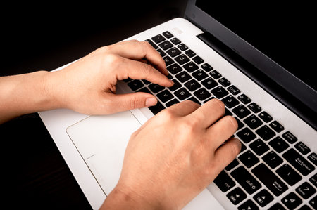 A pair of hands for laptop workの写真素材
