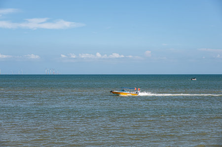On a sunny day in summer, the speedboat drove fast in the blue seaの写真素材