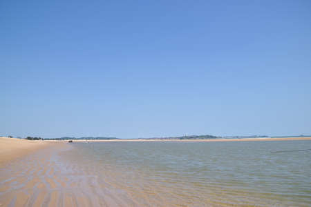 In summer, the sky is blue and the sea is clearの写真素材