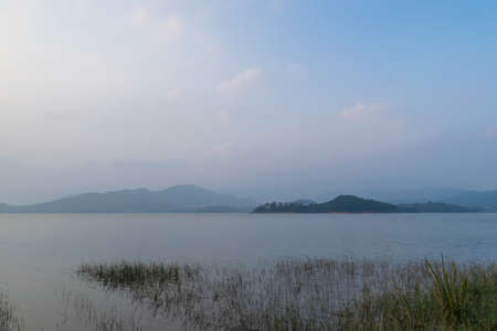 The evening lake reflected the skyの写真素材