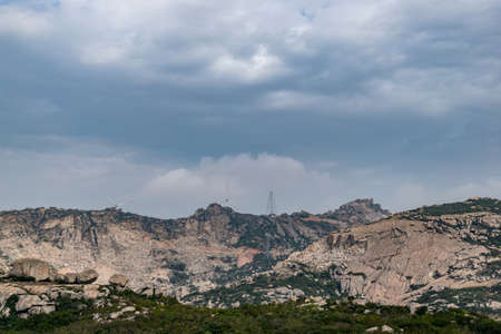 Desolate mountains, many grotesque large stones and few plantsの写真素材