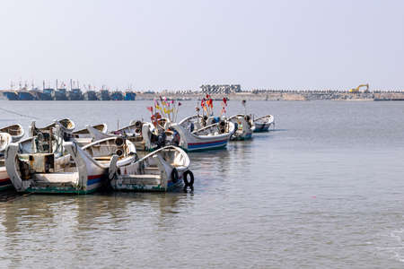 During the fishing moratorium, the fishing boat docked at the seasideの写真素材