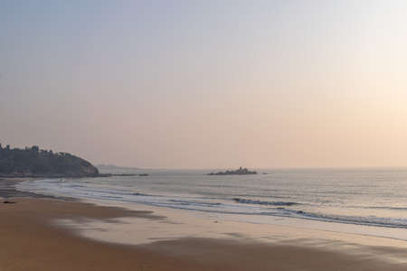 Summer beach, blue sky, golden beach and small wavesの写真素材