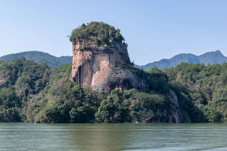The lake reflects the mountains of Danxia landformの写真素材
