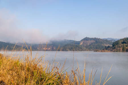 The lake reflects the mountains of Danxia landformの写真素材
