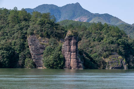 The lake reflects the mountains of Danxia landformの写真素材