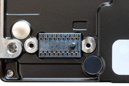 Close up of the back of the black mechanical hard disk on a white background