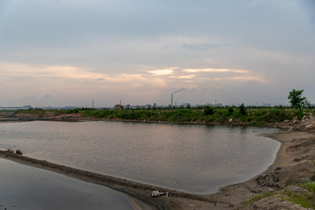 The green plants on the saline alkali land and the water reflect the scenery
