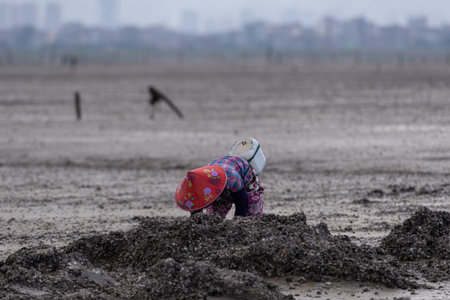 One fishman working on the black beachの写真素材