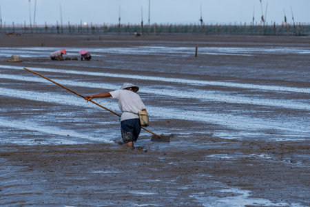 One fishman working on the black beachの写真素材