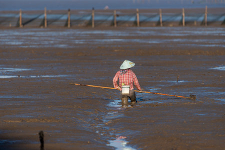 One fishman working on the black beachの写真素材