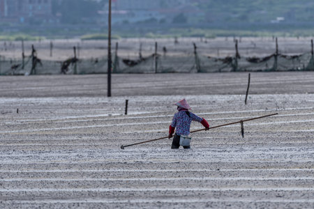 One fishman working on the black beachの写真素材