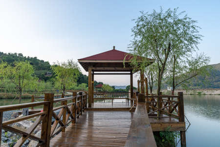 A pavilion by the lake in the countryの写真素材