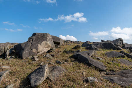 Stones on the plateau meadow under the blue skyの写真素材
