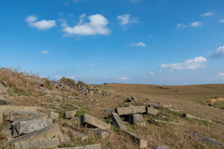 Stones on the plateau meadow under the blue skyの写真素材