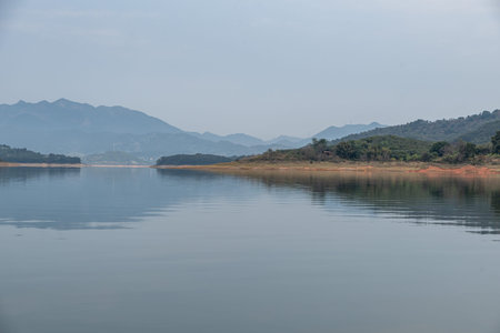 The view of the lake on a cloudy day in autumnの写真素材