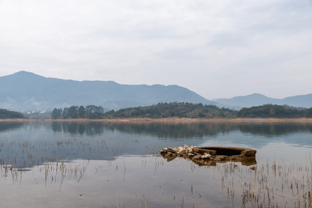 The view of the lake on a cloudy day in autumnの写真素材