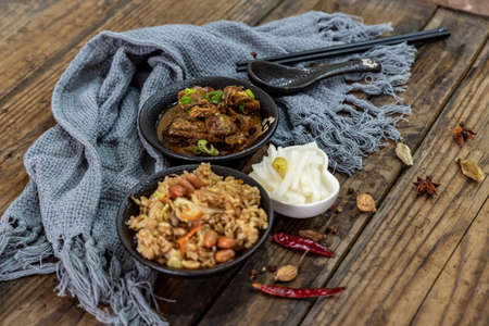Beef food and side dishes are on the wood grain tableの写真素材