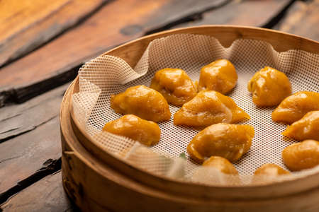 Traditional Chinese banquet dishes, steamed dumplings with corn skinの写真素材