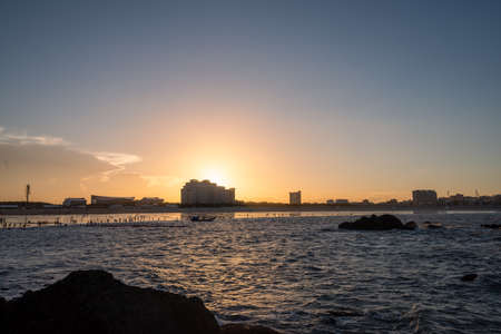 In the evening, the sea slapped the rocksの写真素材
