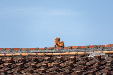 The eaves and corners of traditional Chinese residential buildings are made of red brick and limeのeditorial素材