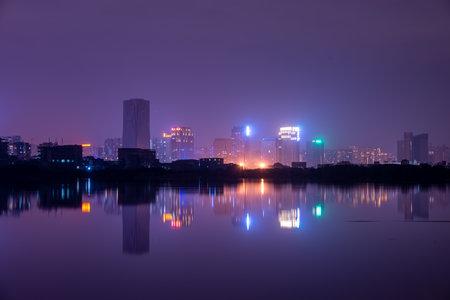 A city reflected by the lake at nightのeditorial素材