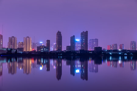 A city reflected by the lake at nightのeditorial素材