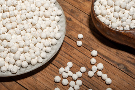 Gorgon fruit in a bowl or plate on a wood grain tableの写真素材