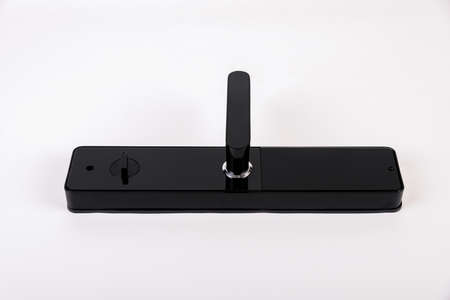 A metal Intelligent lock made of black paint is locked on a white backgroundの写真素材