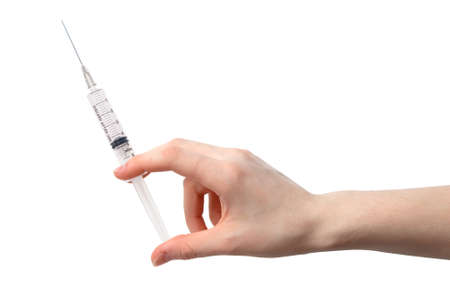 syringe in a hand of a womanの写真素材