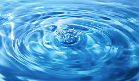 Big splash in blue waterの写真素材