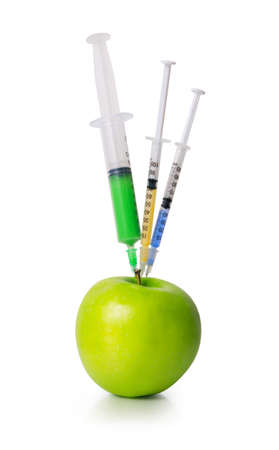 Green apple with a syringesの写真素材