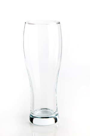 Empty glass for beer isolated on whiteの写真素材