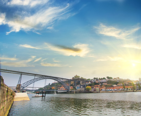 Colorful background, view of Douro riverside with the Dom Luiz bridge, Porto, Portugal. Travel backgroundの写真素材