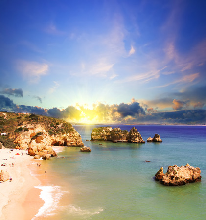 Rocky beach at sunset, Lagos, Portugal. Counter light. Travel and business backgroundの写真素材