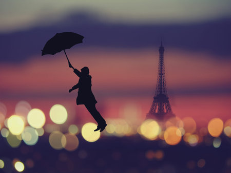Abstract background. silhouette of a man holding umbrella flying over night Paris, France with eiffel tower on a background. Vintage style colored pictureの写真素材