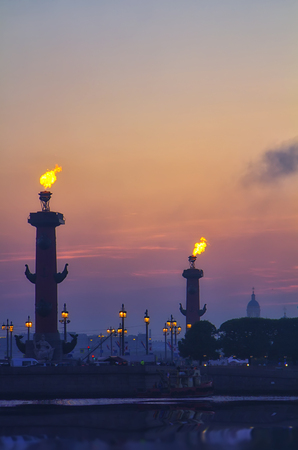 Classic view of Saint-Petersburg (St.Petersburg) river scape at sunset. Spit of Vasilyevsky Island. Neva River. Rastral columns with firesの写真素材