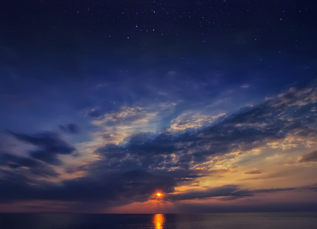 Beautiful sunset sky with stars and clouds. Natural backgroundの写真素材