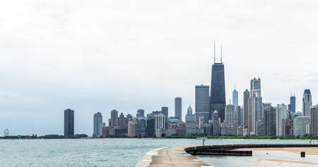 Chicago Illionois, US July 17 2016: Chicago Skyline and people bathing in Michigan lake on a hot summer afternoonのeditorial素材