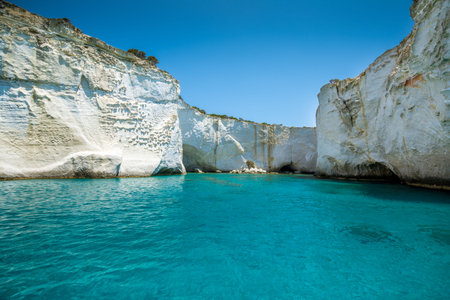 Rock formations and sea caves at Kleftiko shoreline in Milos, Greeceの写真素材