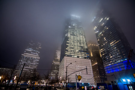 New York, US - March 29, 2018:  The famous world trade center under heavy fog at night in New York Cityのeditorial素材