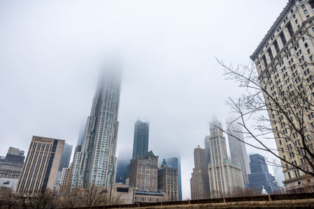 New York, US - March 29, 2018: Downtown Manhattan with buildings obsucured under heavy fogのeditorial素材