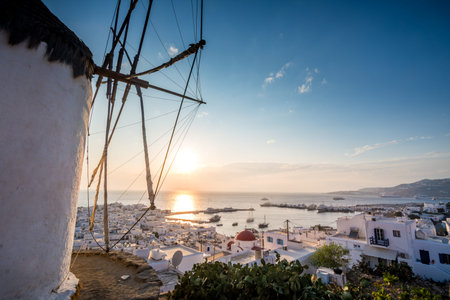 Sunset at Mykonos chora with part of a windmill in view