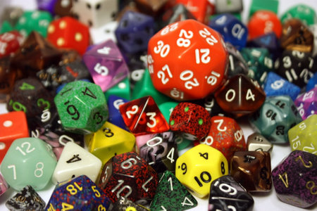 A variety of dice in a pile