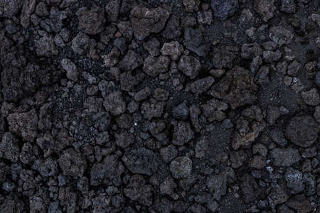 Background texture from volcanic lava stones. Volcanic rock from Etna, Sicily, Italyの写真素材