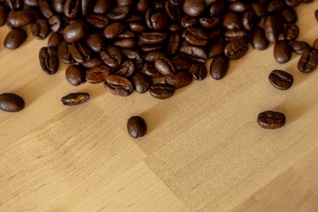 Brown Roasted Coffee Beans Closeup On Wooden Backgroundの写真素材