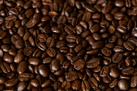 Brown Roasted Coffee Beans Closeup On Dark Backgroundの写真素材