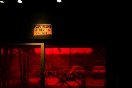 No oxygen sign on wall near red windowの写真素材
