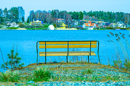 Chill bench by a lakeの写真素材