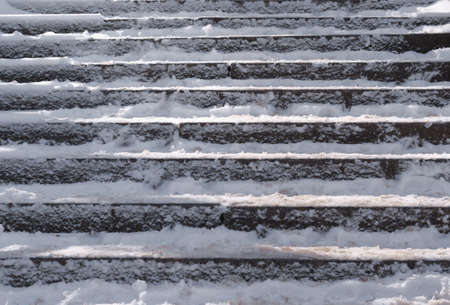 Snow covered slippery stair case abstract winter background compositionの写真素材